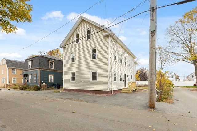a view of a house with a street