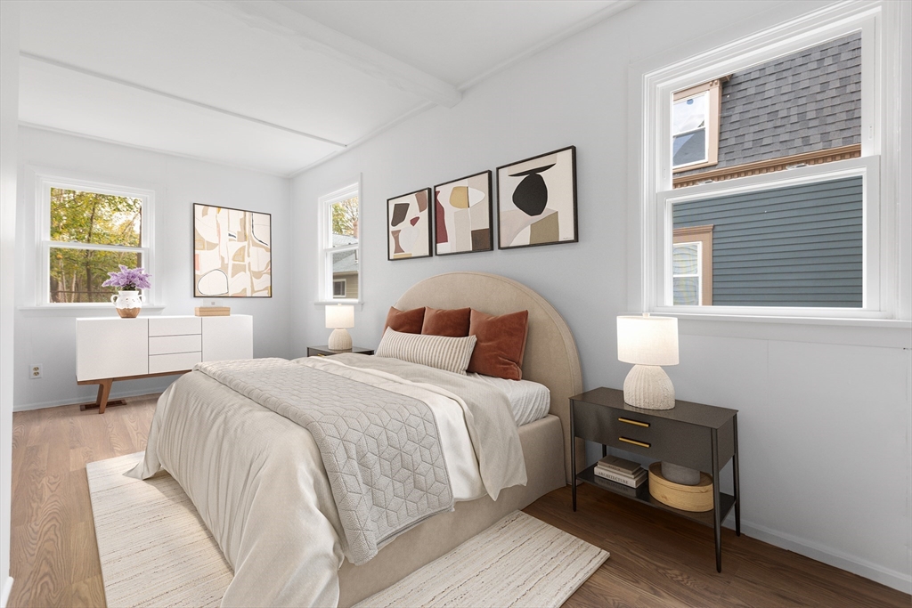 12 Thorndike Street Salem, MA 01970 - Photo 5 of 14 a bed room with a bed and a chair