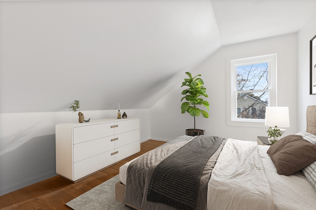 12 Thorndike Street Salem, MA 01970 - Photo 10 of 14 a bedroom with a bed and a window