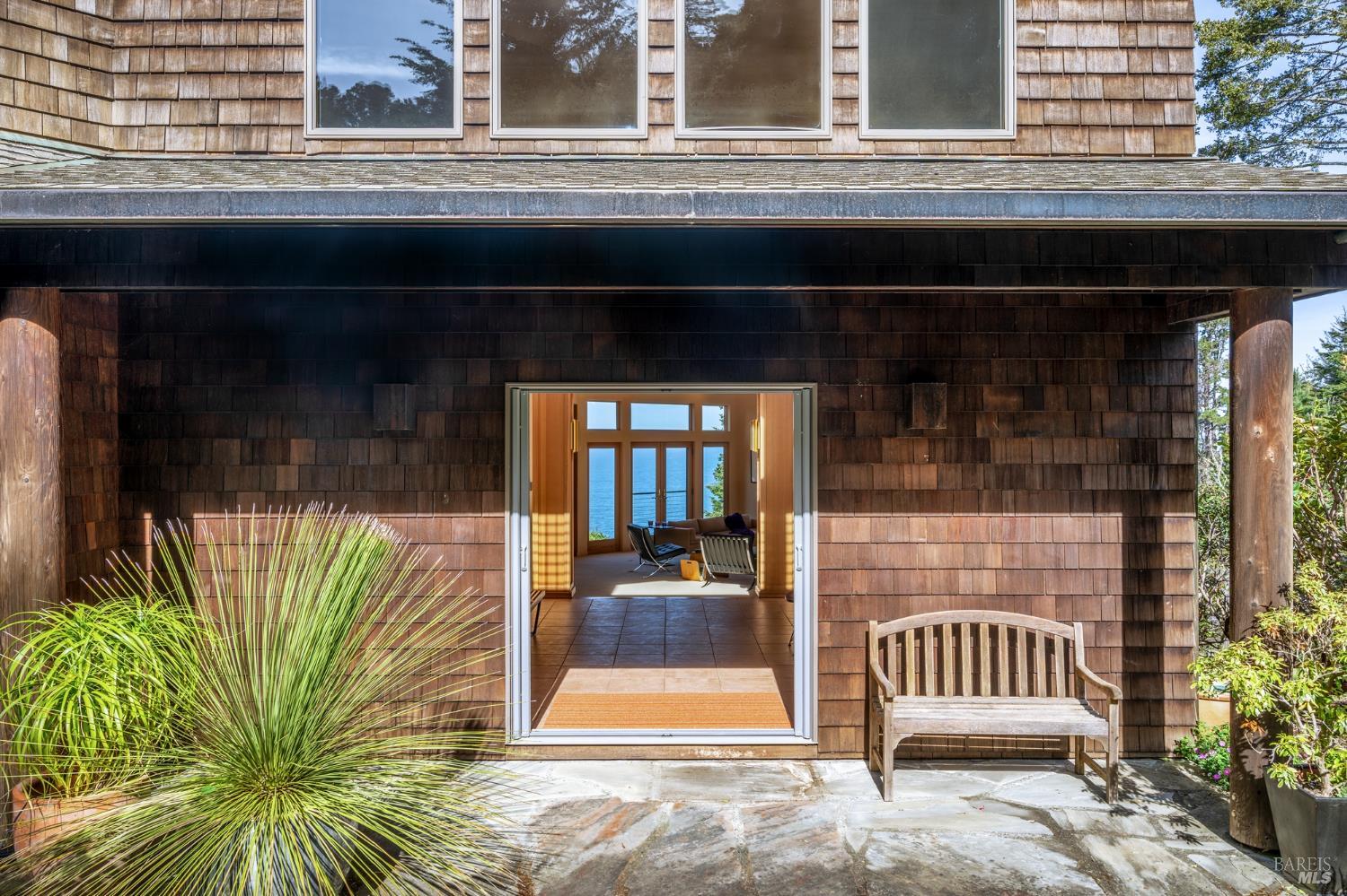 35148 Crows Nest Drive The Sea Ranch, CA 95497 - Photo 12 of 94 a front view of a house with a glass door