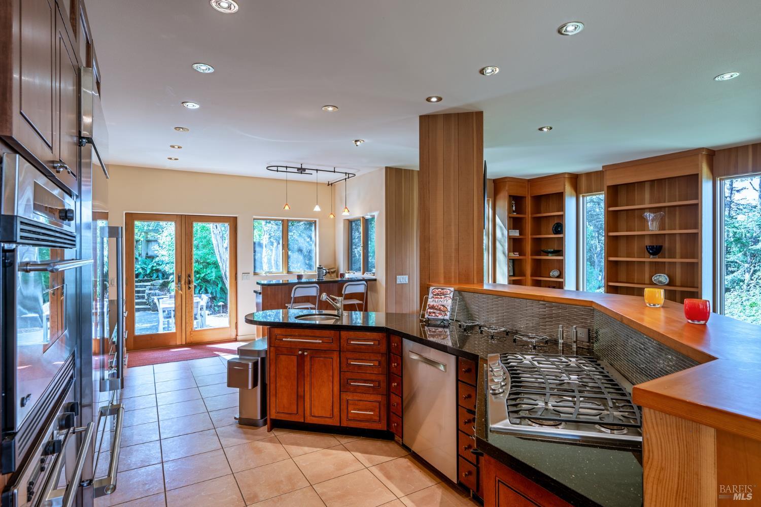 35148 Crows Nest Drive The Sea Ranch, CA 95497 - Photo 26 of 94 a kitchen with stainless steel appliances granite countertop a stove and a sink