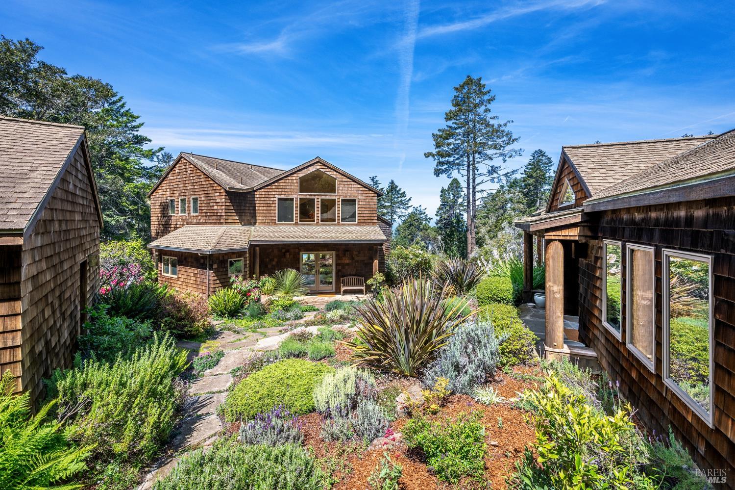35148 Crows Nest Drive The Sea Ranch, CA 95497 - Photo 3 of 94 a front view of a house with a yard