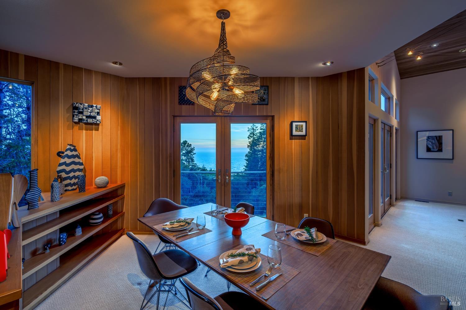 35148 Crows Nest Drive The Sea Ranch, CA 95497 - Photo 38 of 94 a view of a dining room with furniture a chandelier and wooden floor
