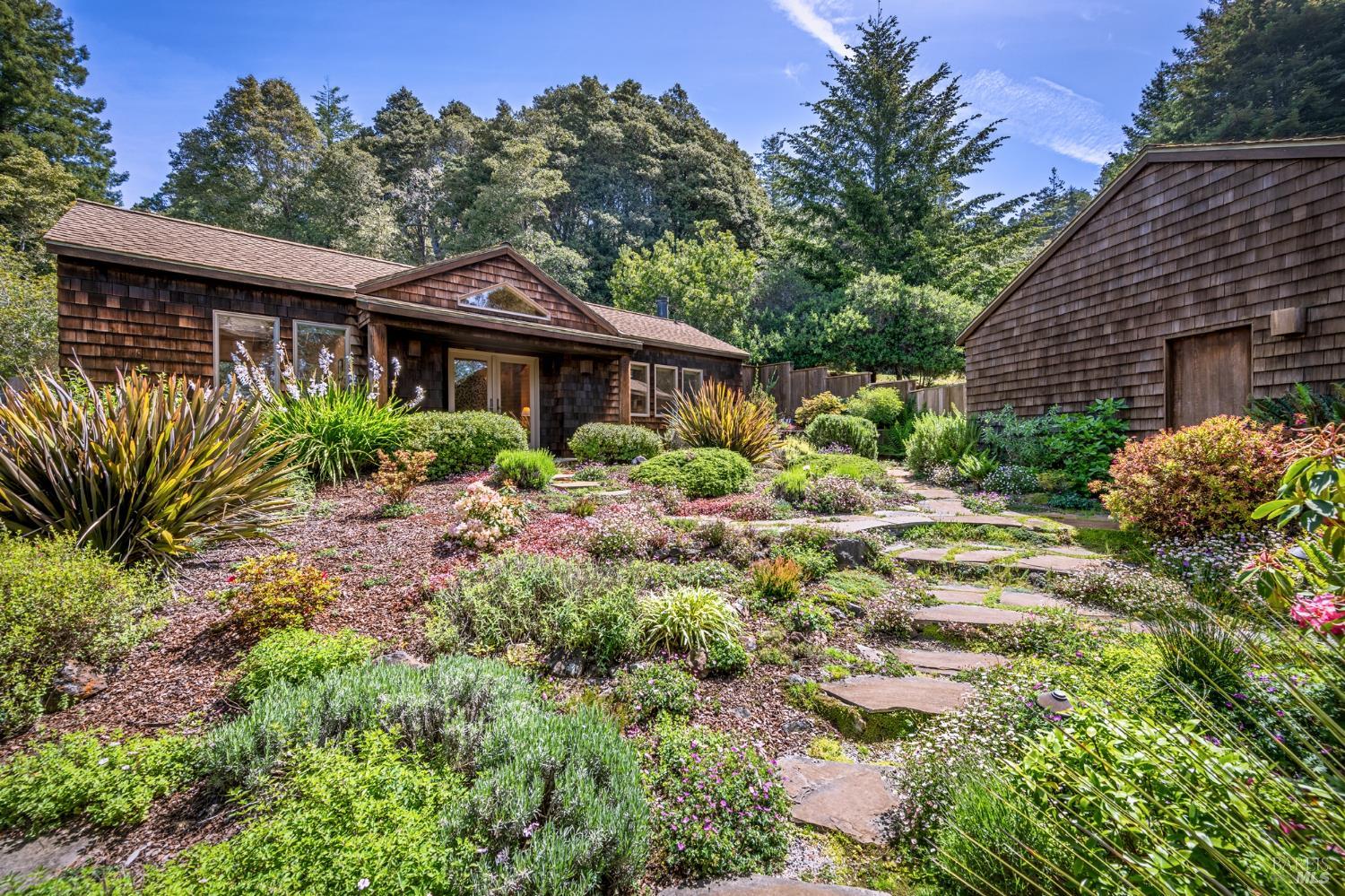 35148 Crows Nest Drive The Sea Ranch, CA 95497 - Photo 4 of 94 a view of a house with a small yard and plants