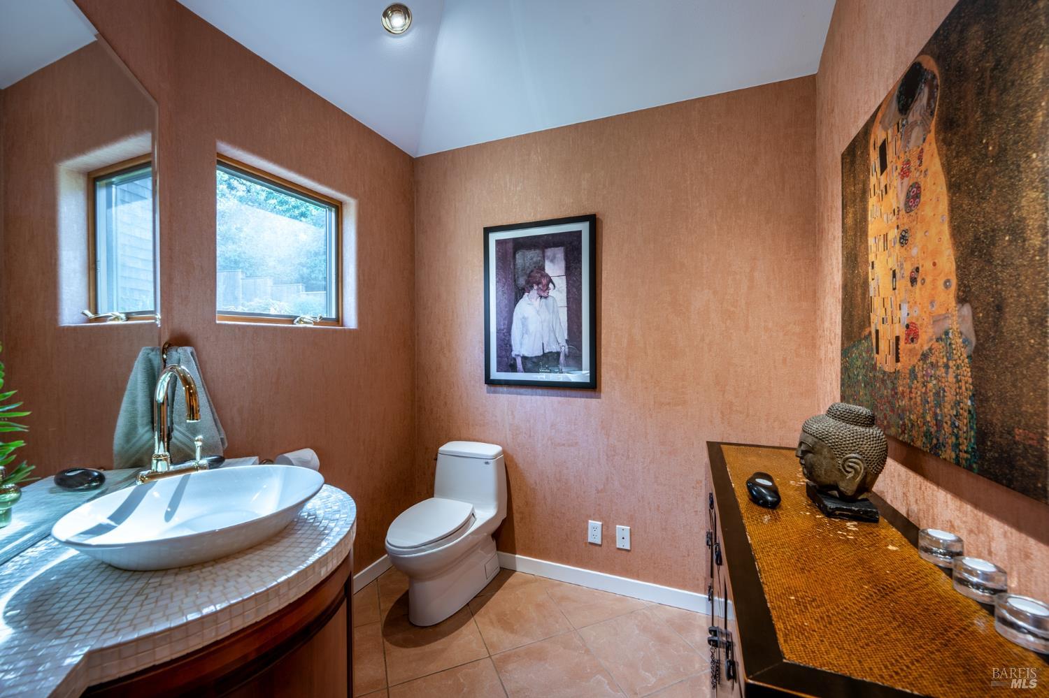 35148 Crows Nest Drive The Sea Ranch, CA 95497 - Photo 42 of 94 a bathroom with a granite countertop toilet a sink and a mirror