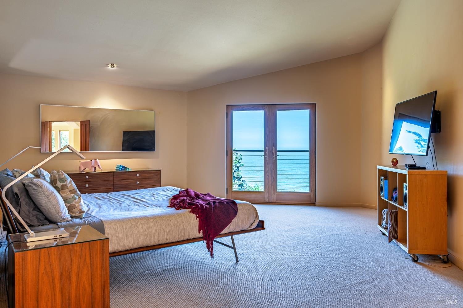 35148 Crows Nest Drive The Sea Ranch, CA 95497 - Photo 49 of 94 a bedroom with furniture and a flat screen tv