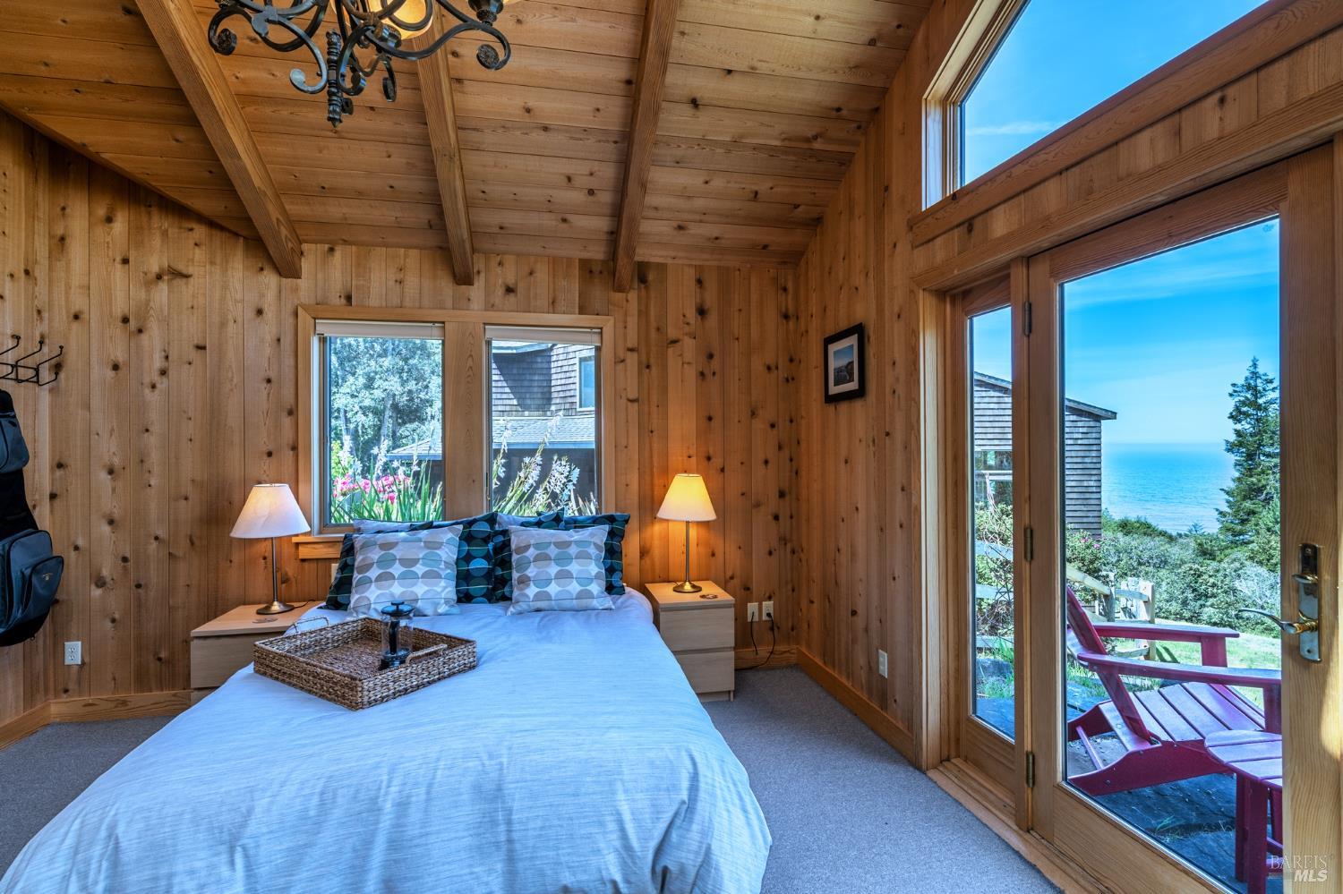35148 Crows Nest Drive The Sea Ranch, CA 95497 - Photo 66 of 94 a bedroom with furniture and a large window