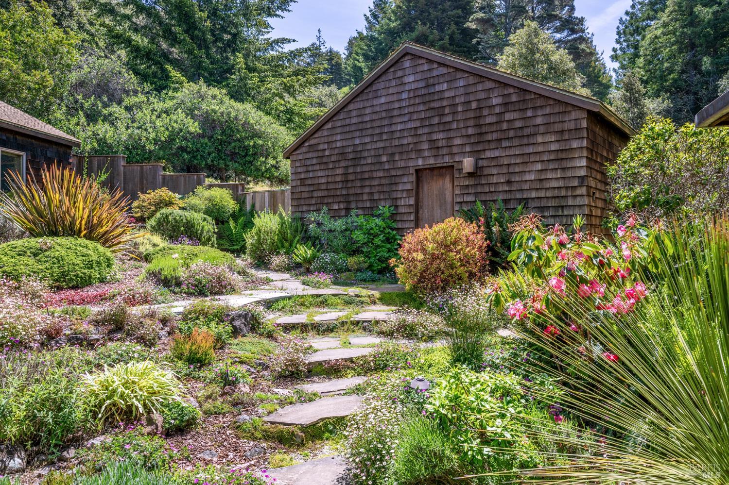 35148 Crows Nest Drive The Sea Ranch, CA 95497 - Photo 79 of 94 a backyard of a house with a garden and plants