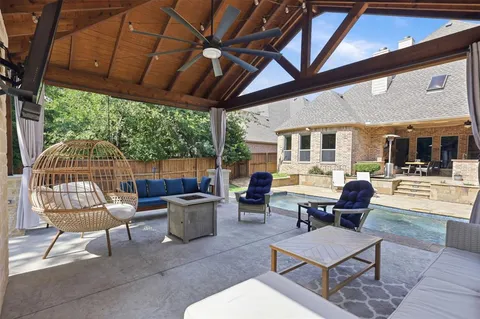 a outdoor living space with furniture and garden view