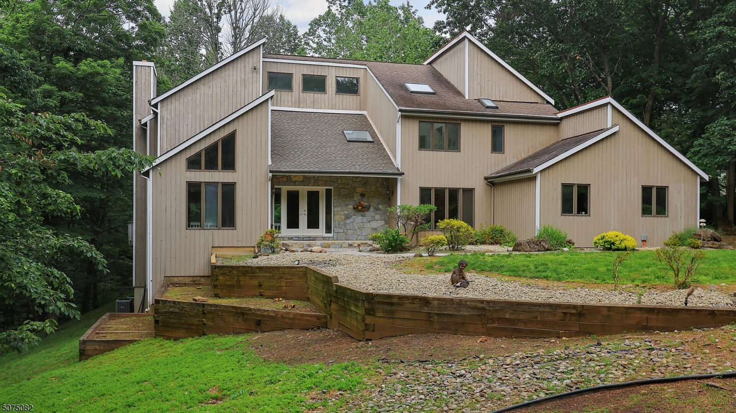 a front view of a house with garden