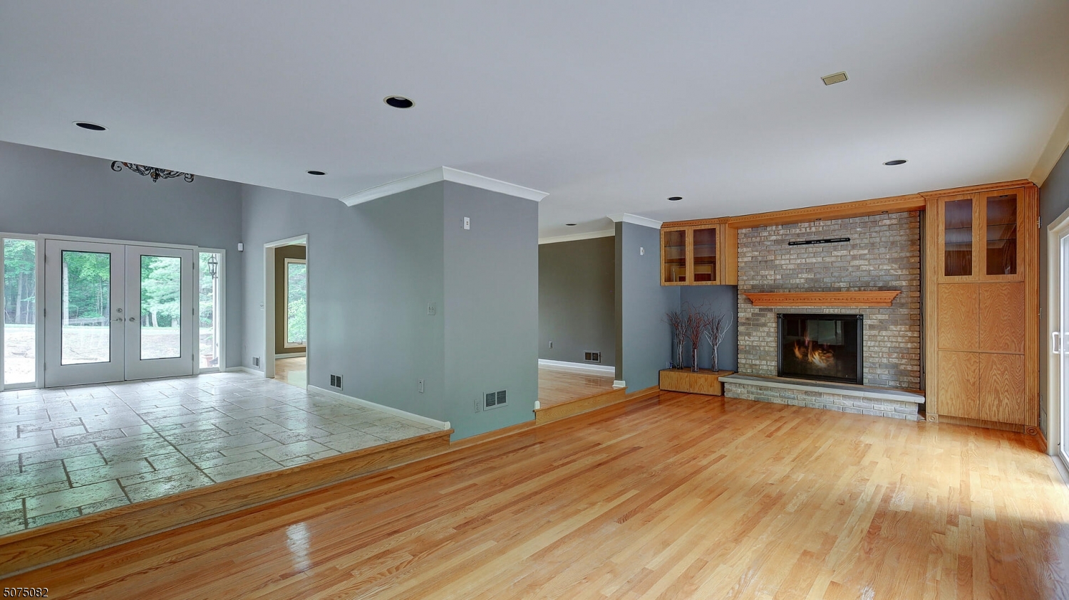 17 Adams Road Bridgewater, NJ 08836 - Photo 7 of 25 a view of an empty room with wooden floor fireplace and a window