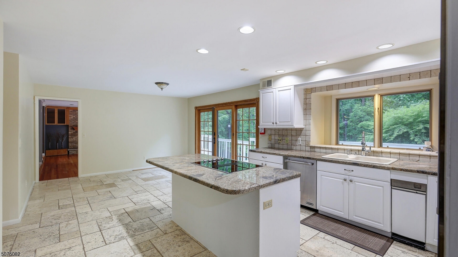 17 Adams Road Bridgewater, NJ 08836 - Photo 10 of 25 a kitchen with granite countertop a stove sink and cabinets