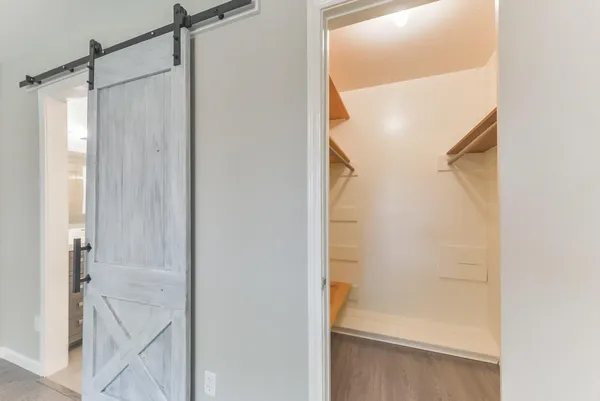 a bathroom with a glass shower door