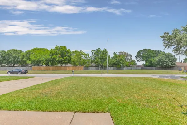 a view of a swimming pool and a yard