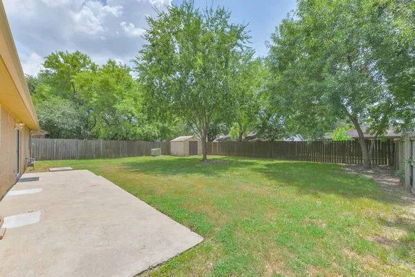 a view of a backyard with a small cabin