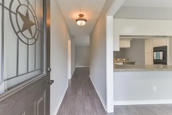 a view of a kitchen from the hallway