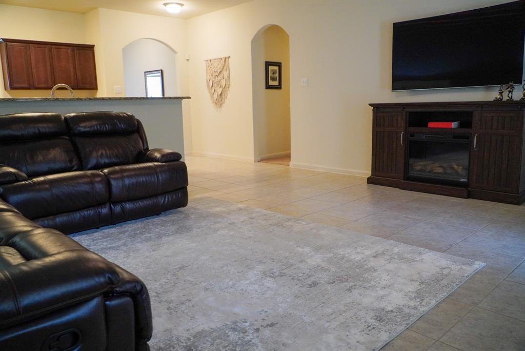 13624 Helix Bridge Way Crowley, TX 76036 - Photo 7 of 25 a living room with furniture and a flat screen tv