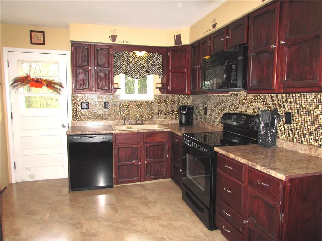 411 Beech Road Plum, PA 15239 - Photo 14 of 25 The Refrigerator, Stove, Microwave Oven & Dishwasher are all included with the home.