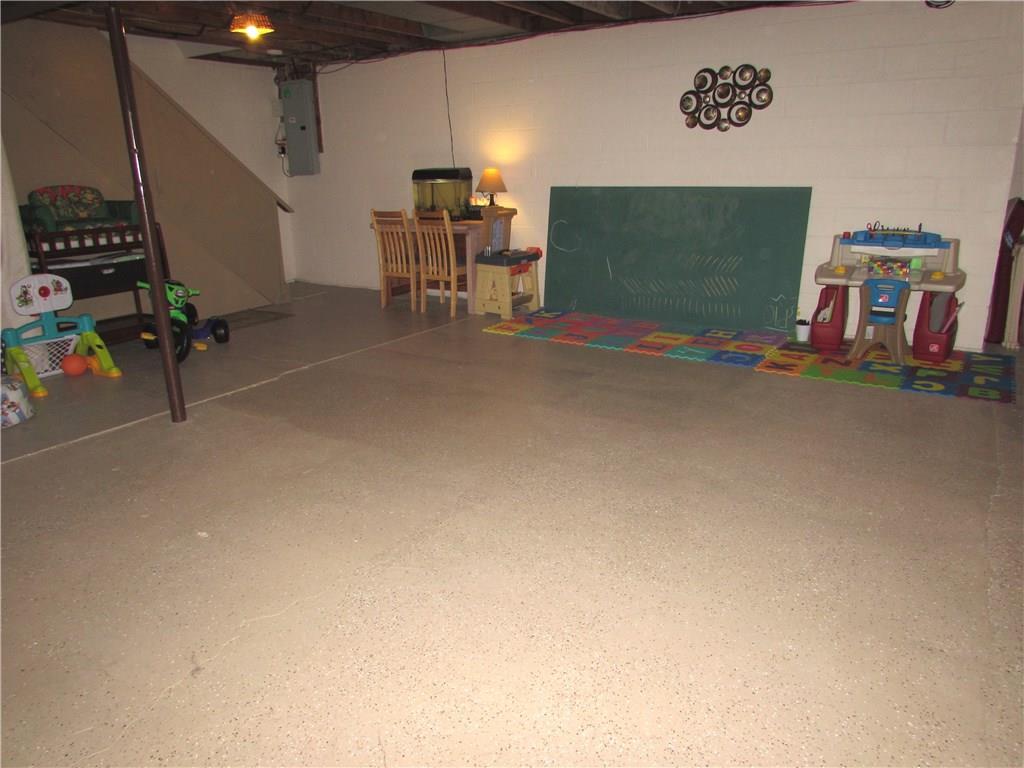 411 Beech Road Plum, PA 15239 - Photo 23 of 25 The Attached Garage allows for a Huge Lower Level that is ready for your Finishing Touches.