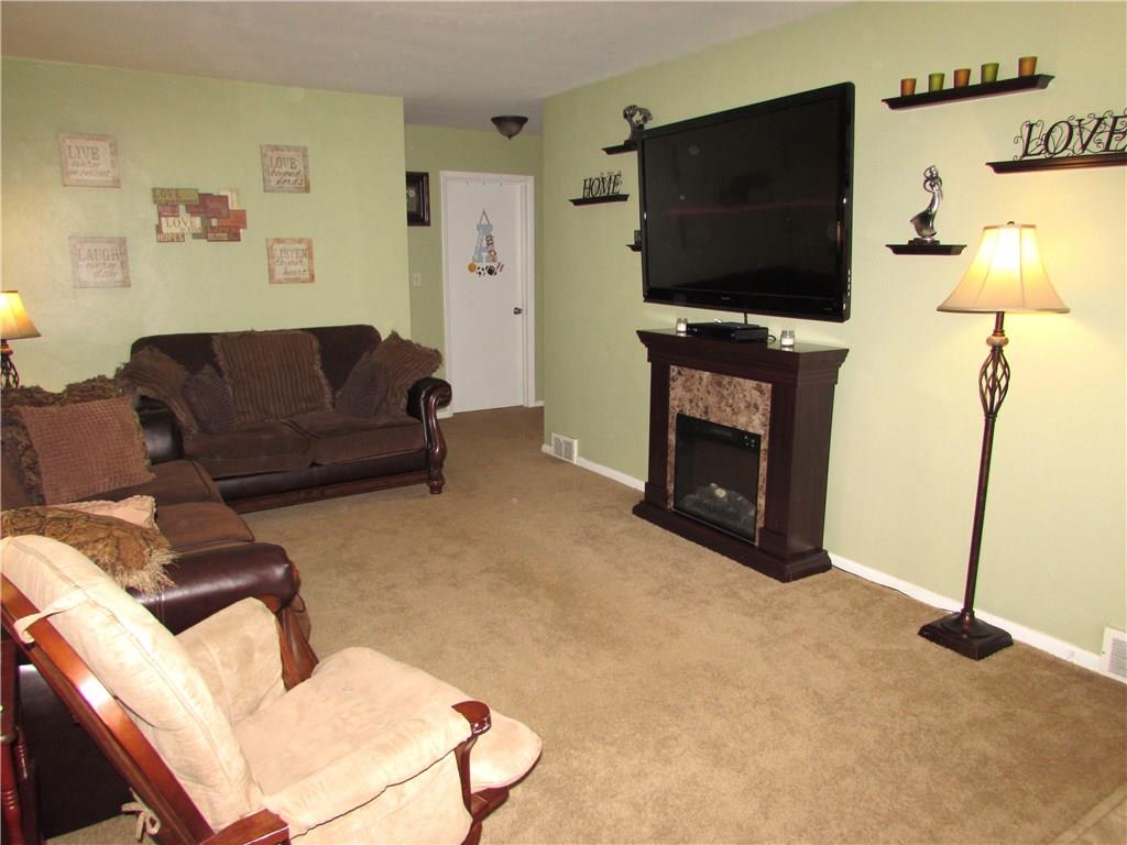 411 Beech Road Plum, PA 15239 - Photo 7 of 25 The adjacent Living Room has Fresh Paint, Neutral Carpeting that was just professionally cleaned, and large front windows that fill the room with Natural Light