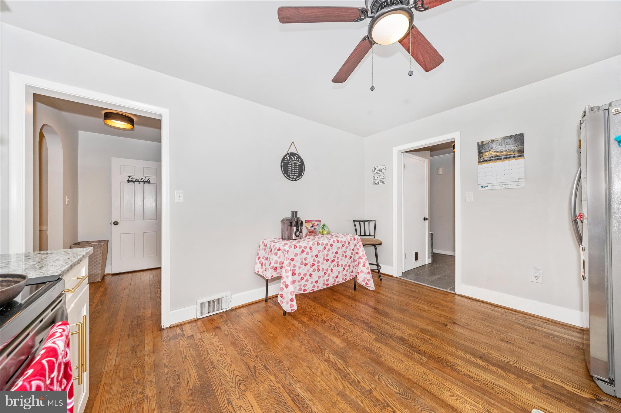 18826 Preston Road Hagerstown, MD 21742 - Photo 15 of 60 a living room with wooden floor furniture and a chandelier