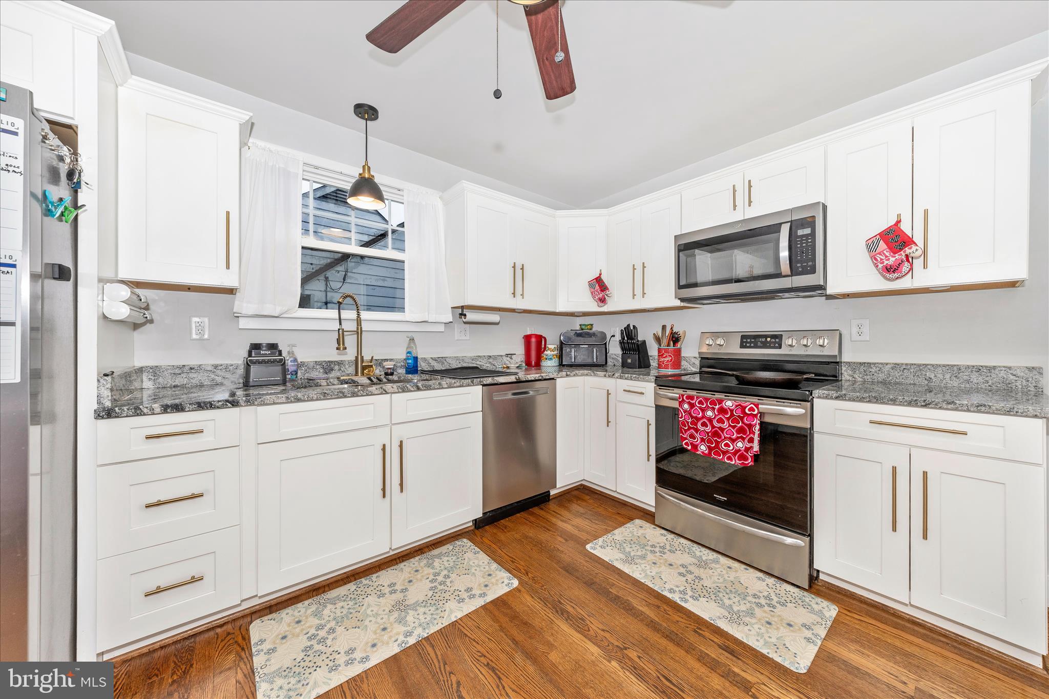 18826 Preston Road Hagerstown, MD 21742 - Photo 16 of 60 a kitchen with stainless steel appliances granite countertop a stove a sink and a refrigerator