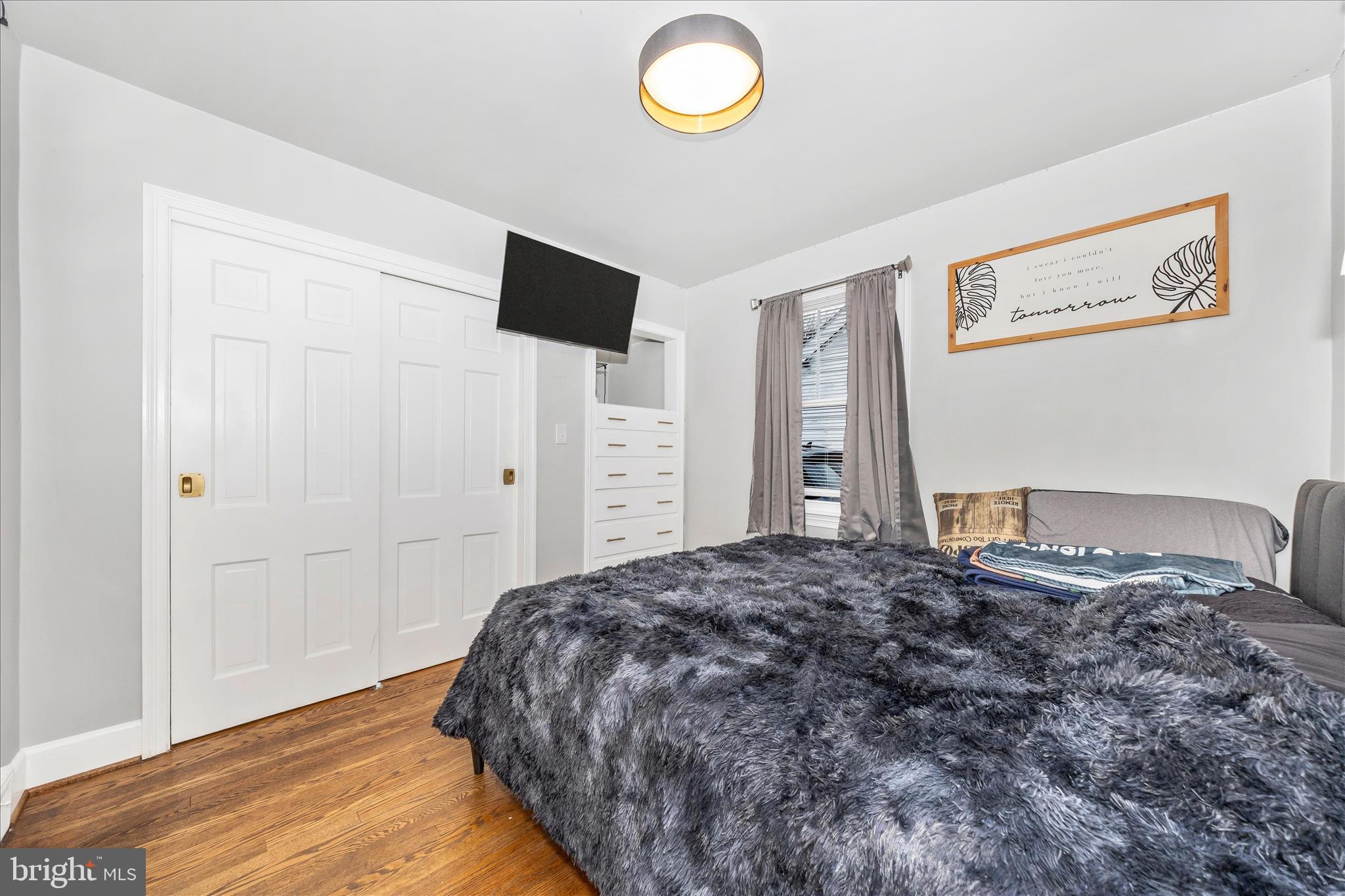 18826 Preston Road Hagerstown, MD 21742 - Photo 17 of 60 a bedroom with a bed and a flat screen tv