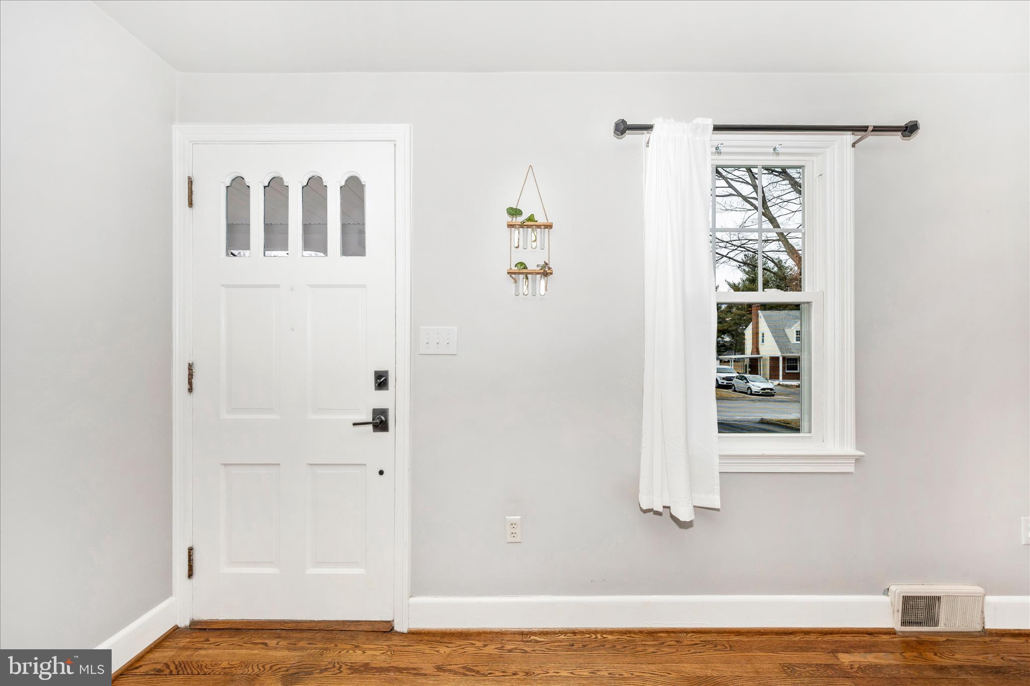 18826 Preston Road Hagerstown, MD 21742 - Photo 2 of 60 a view of a bedroom with wooden floor and a window