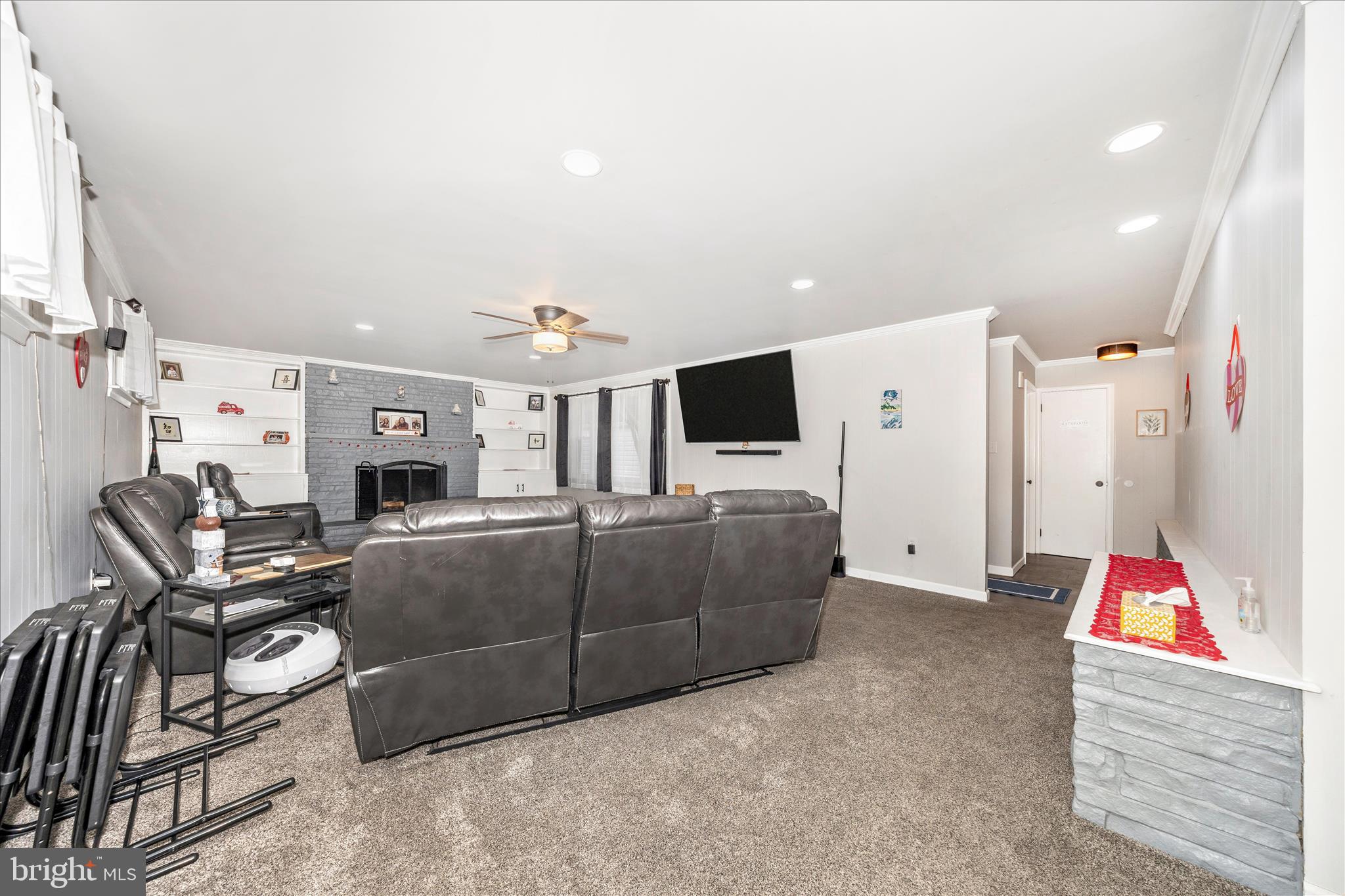 18826 Preston Road Hagerstown, MD 21742 - Photo 21 of 60 a living room with furniture gym equipment and a flat screen tv