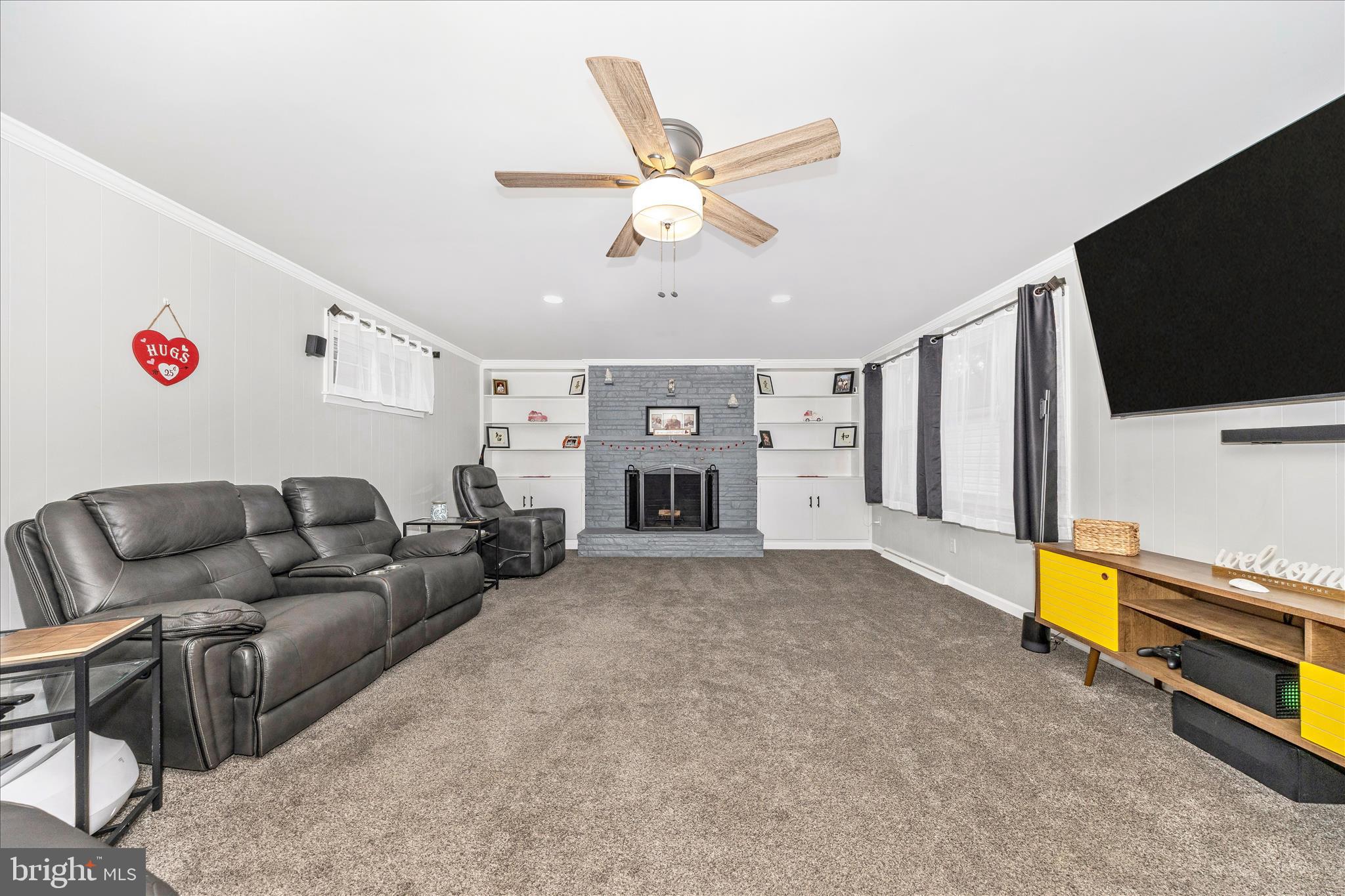 18826 Preston Road Hagerstown, MD 21742 - Photo 24 of 60 a living room with furniture and a flat screen tv