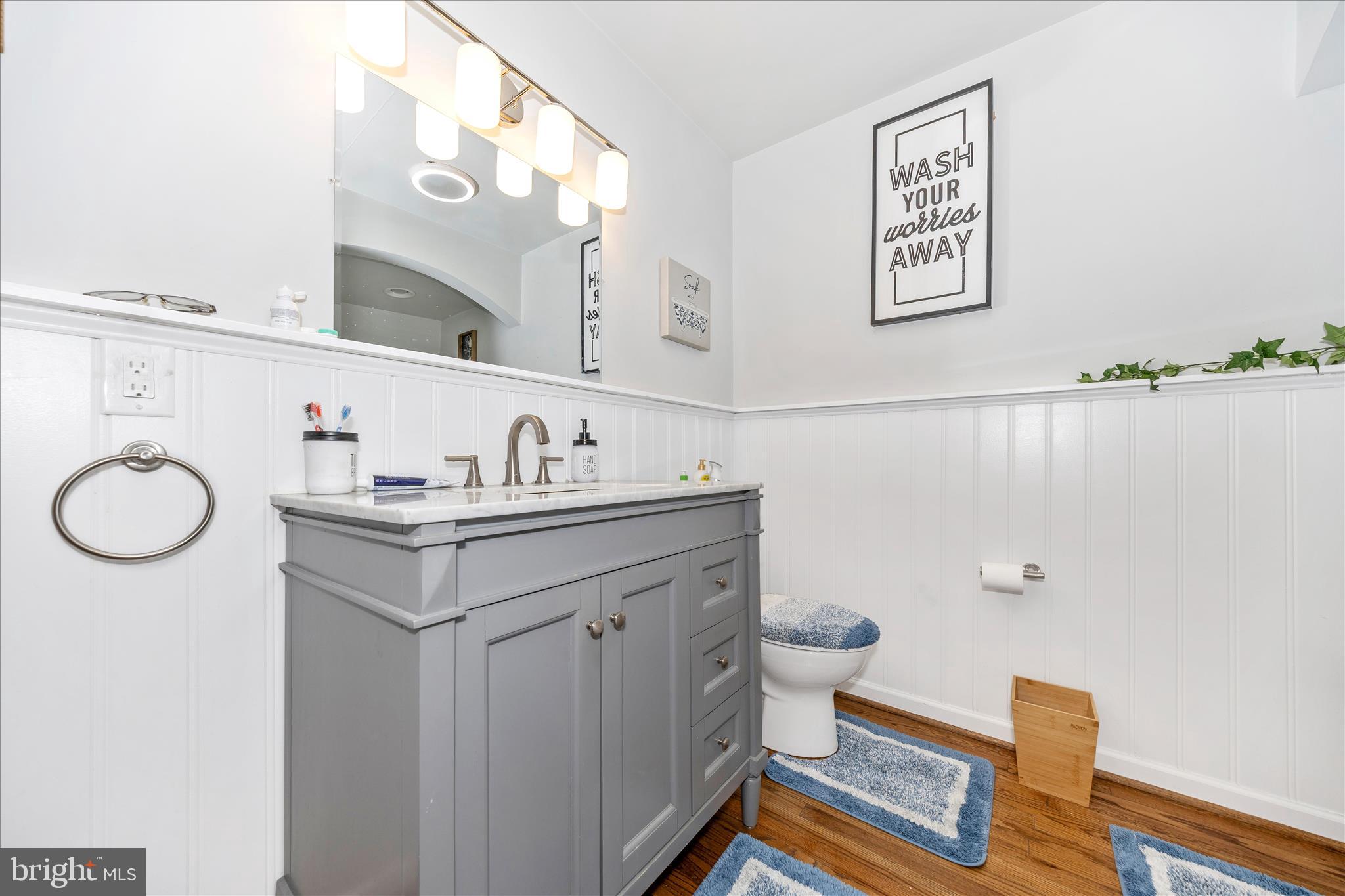 18826 Preston Road Hagerstown, MD 21742 - Photo 26 of 60 a bathroom with a sink mirror vanity and toilet
