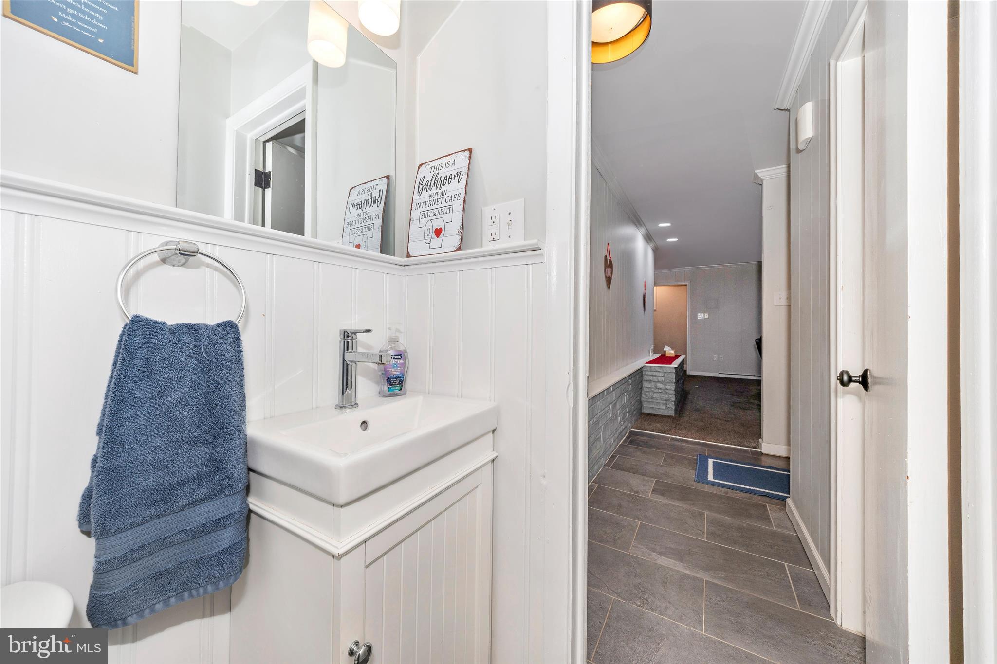 18826 Preston Road Hagerstown, MD 21742 - Photo 32 of 60 a bathroom with a sink and a mirror