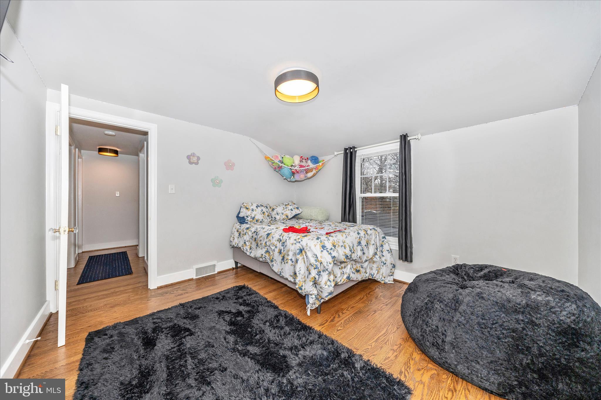 18826 Preston Road Hagerstown, MD 21742 - Photo 34 of 60 a bedroom with a bed and a couch