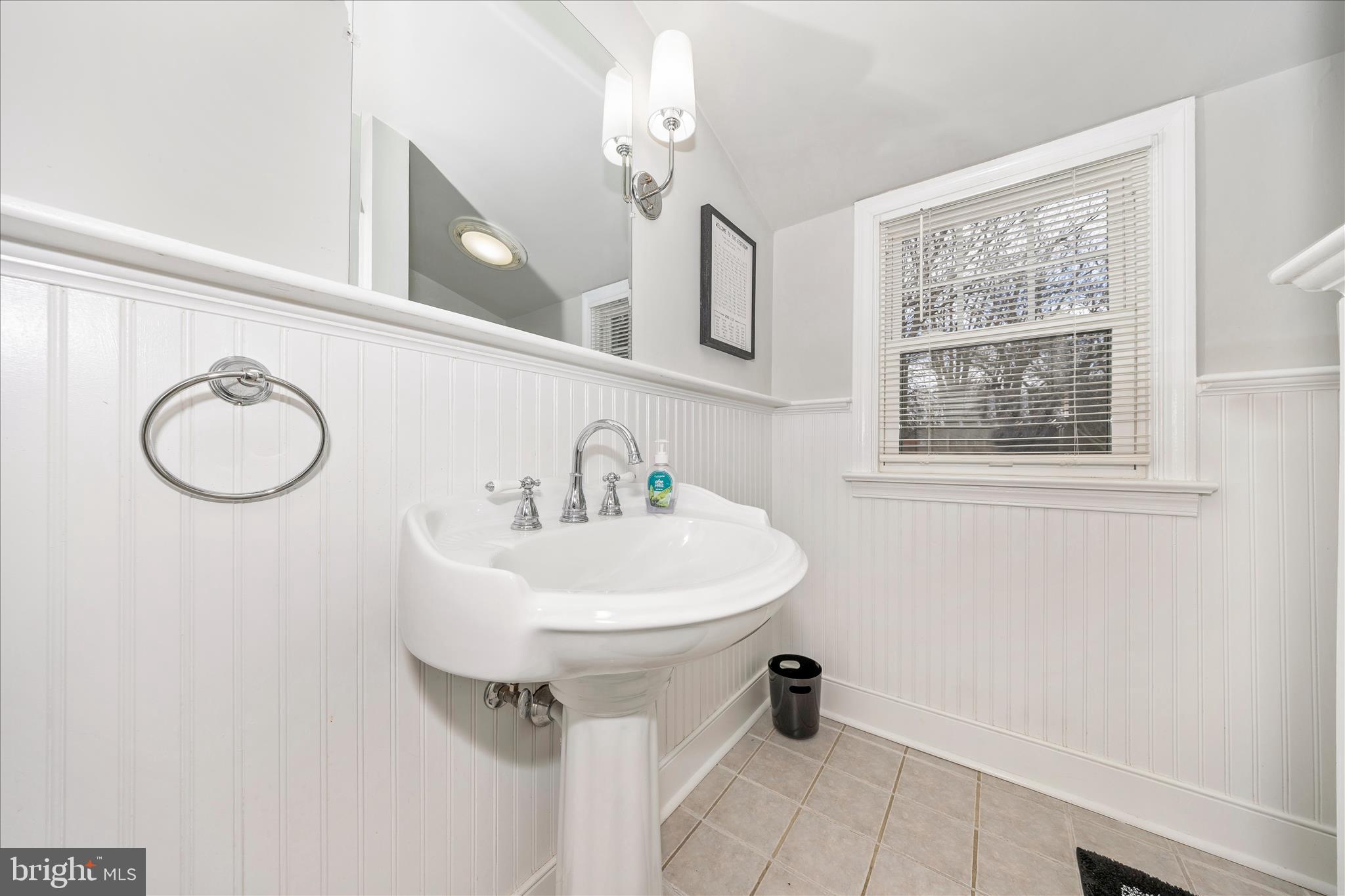 18826 Preston Road Hagerstown, MD 21742 - Photo 41 of 60 a bathroom with a sink a mirror and a window