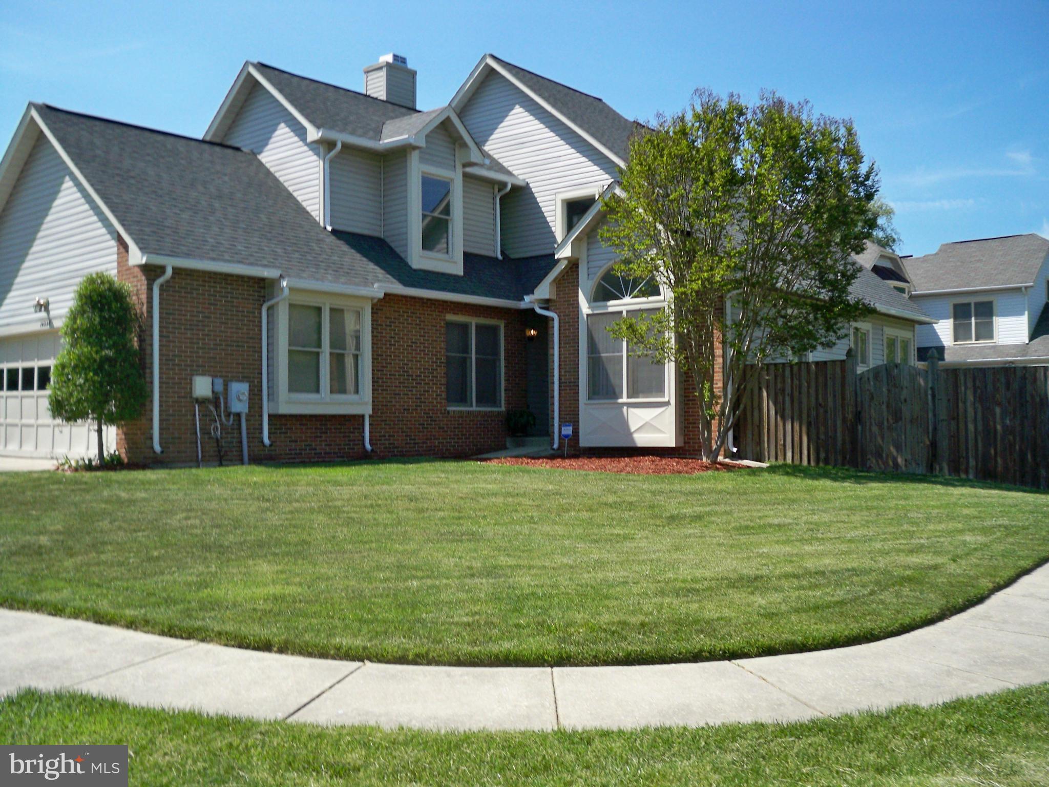 14228 Summit Lane Laurel, MD 20708 - Photo 1 of 30 a front view of a house with a garden