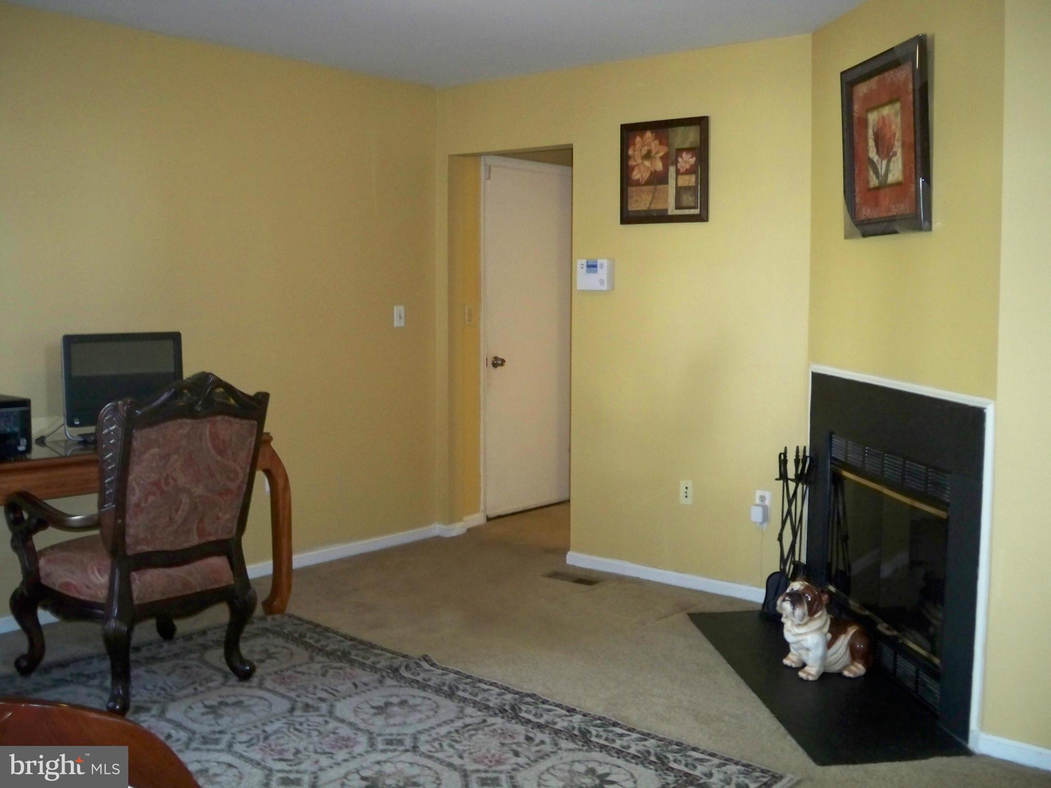 14228 Summit Lane Laurel, MD 20708 - Photo 11 of 30 a room with a chair and gym equipment