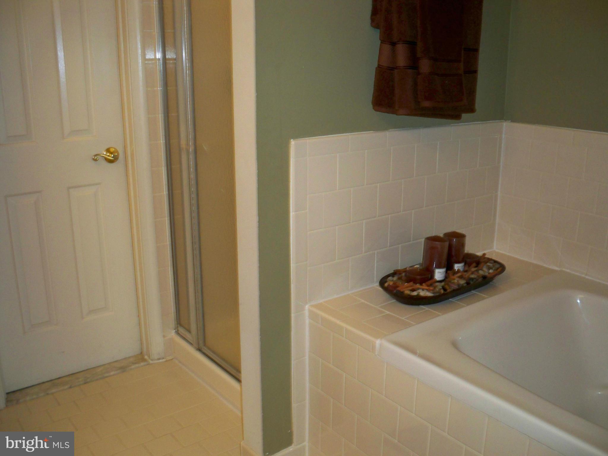 14228 Summit Lane Laurel, MD 20708 - Photo 15 of 30 a bathroom with a sink and a mirror