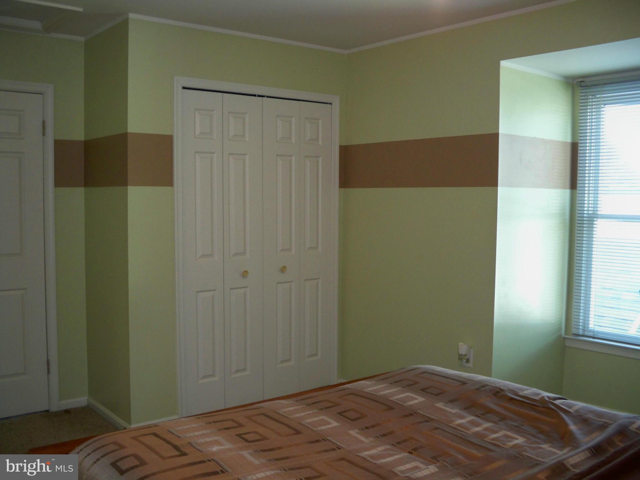 14228 Summit Lane Laurel, MD 20708 - Photo 18 of 30 a bedroom with a bed and a window