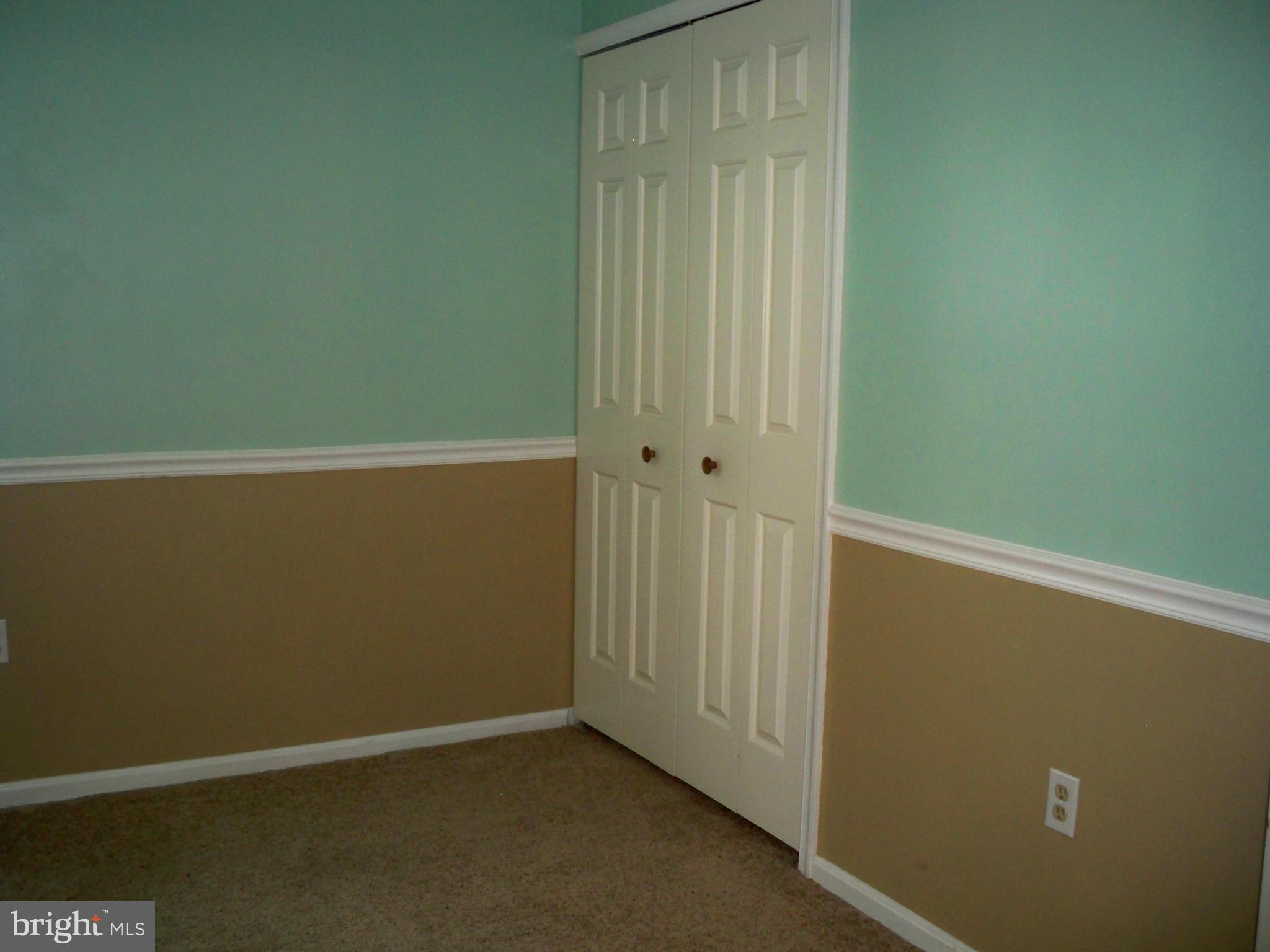 14228 Summit Lane Laurel, MD 20708 - Photo 21 of 30 an empty room with a door