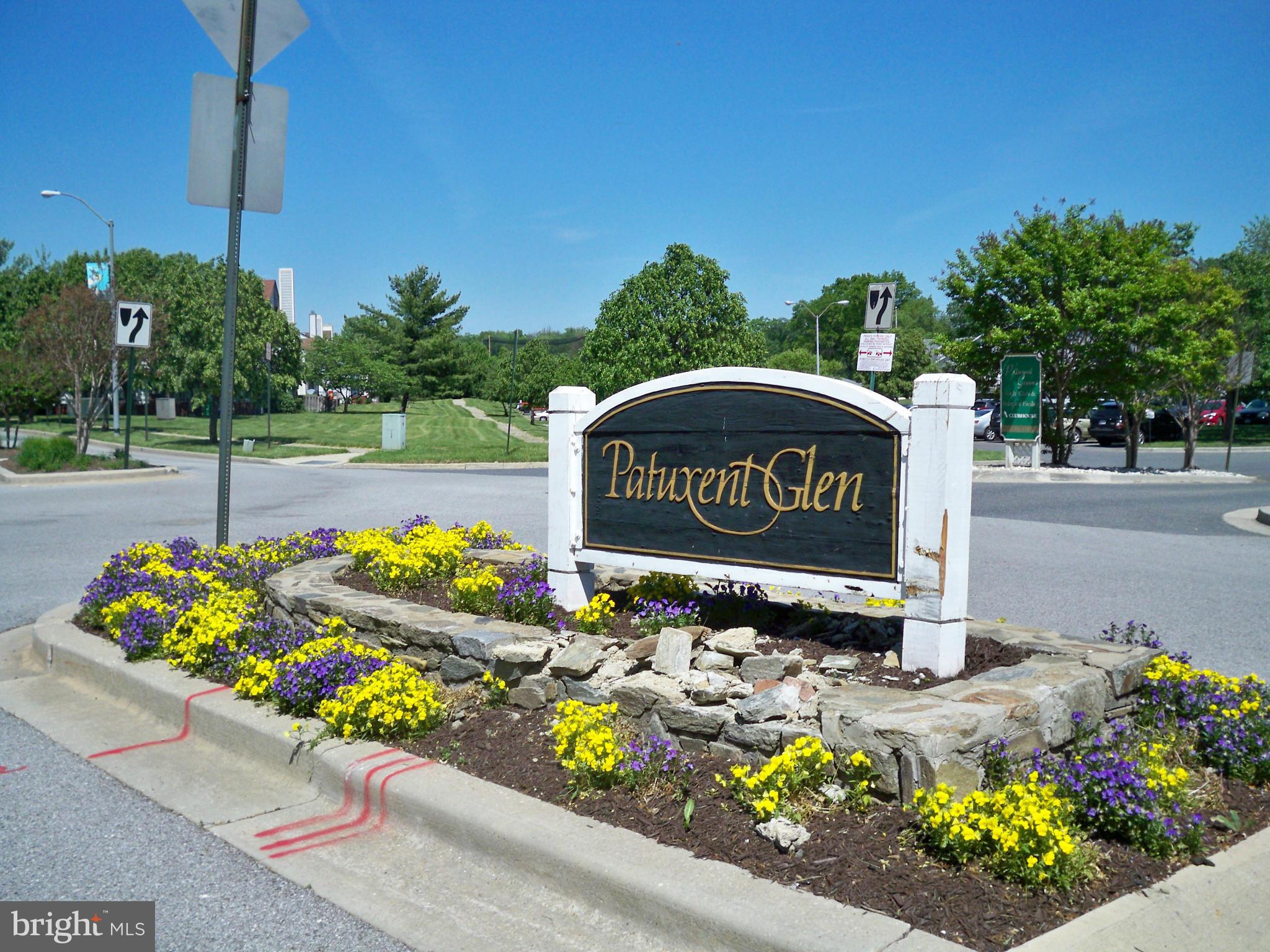 14228 Summit Lane Laurel, MD 20708 - Photo 28 of 30 a sign that is sitting in front of flowers