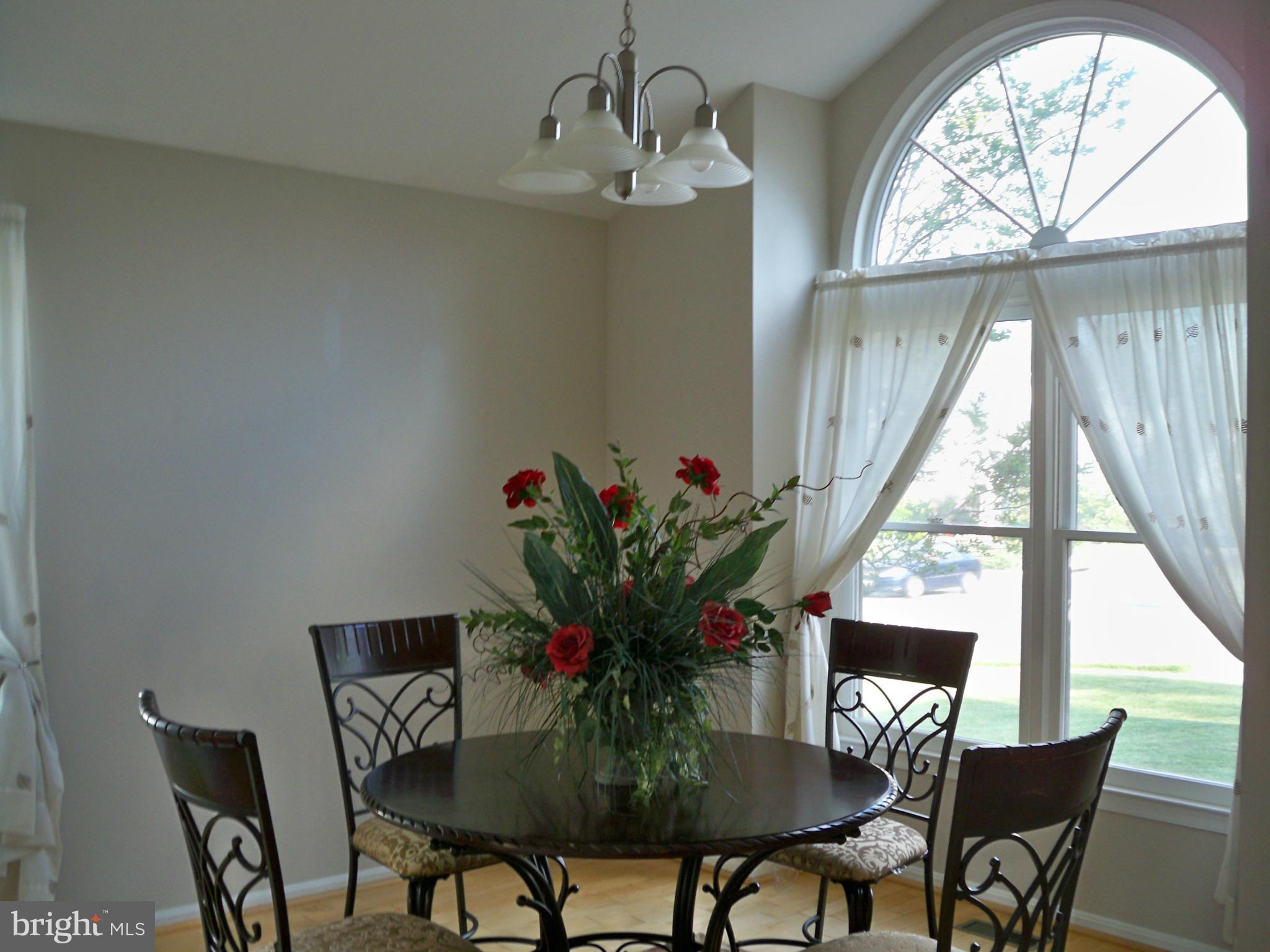 14228 Summit Lane Laurel, MD 20708 - Photo 6 of 30 a view of a dining room with furniture window and outside view