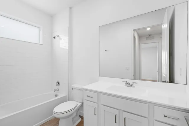 a bathroom with a sink toilet a tub and shower