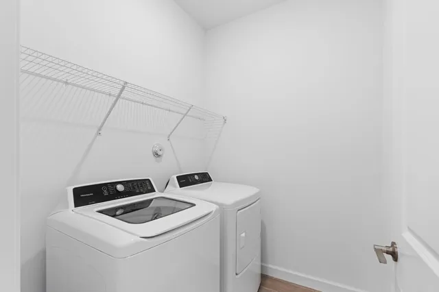 a utility room with dryer and washer