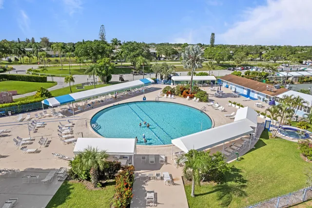 an aerial view of a house with a swimming pool