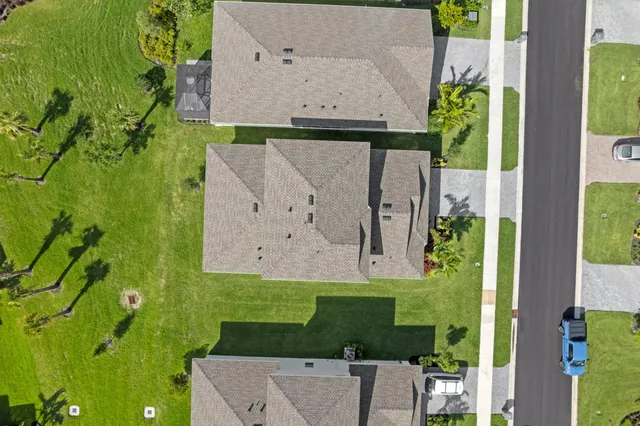 an aerial view of a house with a garden