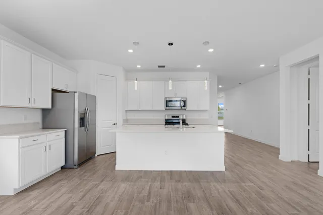 a view of kitchen with wooden floor