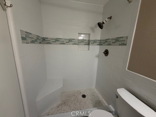 2070 Avenida Placida, Unit 3 Simi Valley, CA 93063 - Photo 15 of 25 a bathroom with a shower and toilet