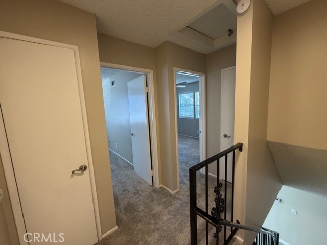 2070 Avenida Placida, Unit 3 Simi Valley, CA 93063 - Photo 17 of 25 a view of a hallway with wooden floor and staircase