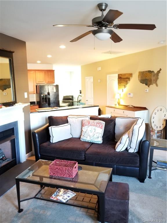 5655 Stafford Road Charlotte, NC 28215 - Photo 2 of 13 a living room with furniture and a fireplace