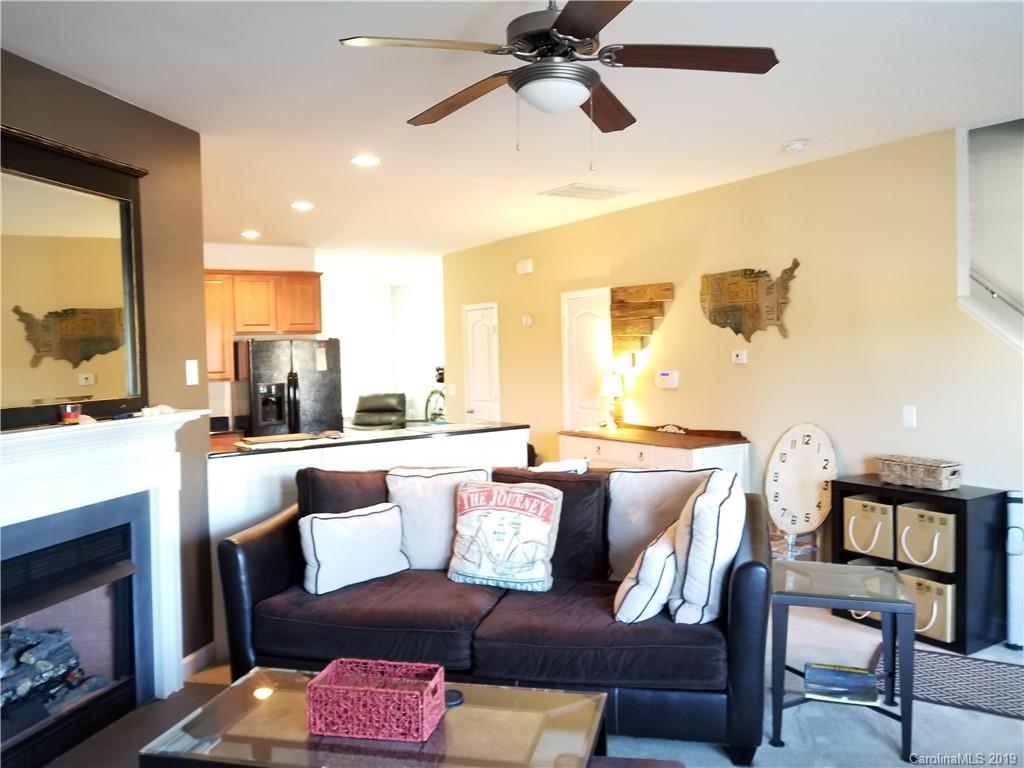 5655 Stafford Road Charlotte, NC 28215 - Photo 13 of 13 a living room with a couch and a fireplace